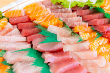 Variety of sashimi in plastic box