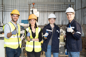 Team technician at work, wear safety uniform, glasses and helmet working  in the industry factory