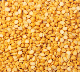 Indian Pulses, Dry organic lentils or chana channa dal top view background or texture