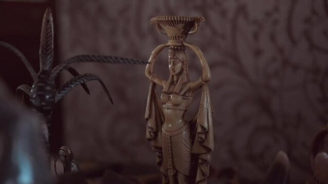 Slow motion of an old Egyptian statue on the blurred background in Alexandria Egypt