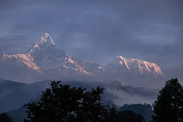 Acrylic prints Himalayas View of Machapuchare (Fish-Tial) mountain at foggy sunrise, situated in the Annapurna mountain massif, North of Pokhare, as seen from Pokhara, Nepal Himalayas, Nepal