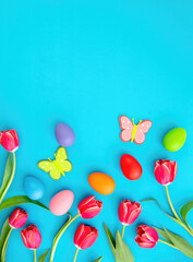 Happy Easter card template, flat lay. Easter egg and tulip decoration on blue background