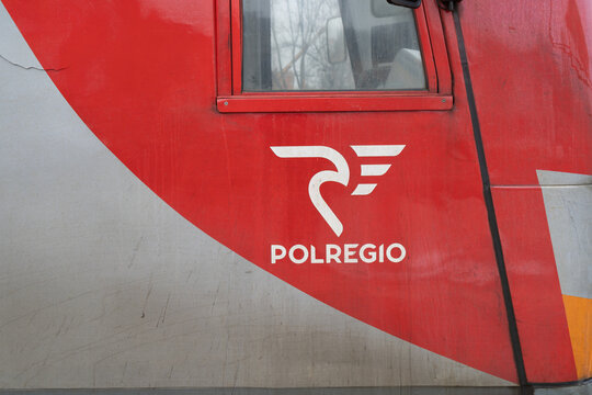 Polregio logo sign, on the side of PKP class EN57 train. Polish regional rail operator logotype on January 30, 2023 in Skawina, Poland.