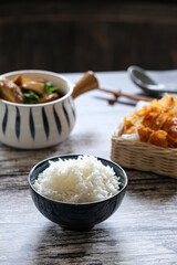 bowl of rice with chicken and fried potatoes chili