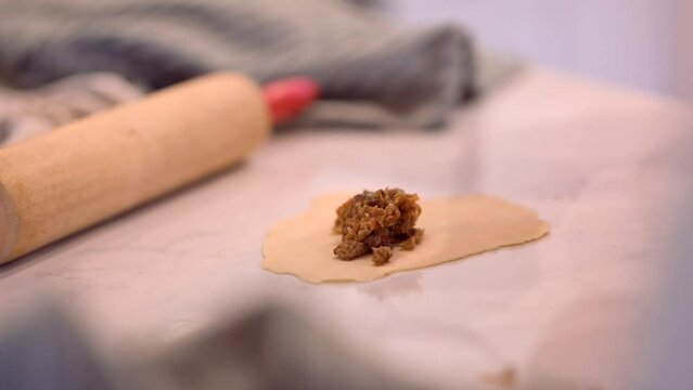 Woman making an eggroll burritos