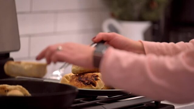 Woman cooking an eggroll burritos
