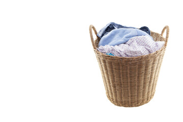 Clothes in a laundry wooden basket isolated on white background. Clipping path.