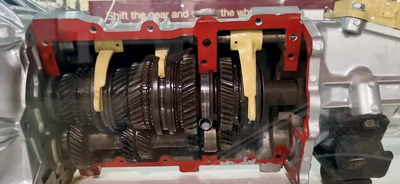 Footage of the cutaway automotive gear box, displaying shifting of the gears. Engineering