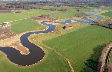 Aerial view of a curvy river near the village of Almen in the Netherlands.
