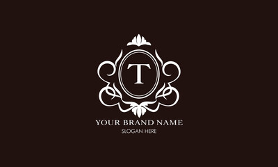 Vector illustration of letter T logo template. Classic floral monogram with decorative elements.