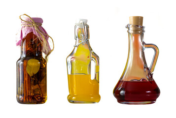 three decorative bottles of different shapes,spices and colored drinks,isolated,culinary background,png