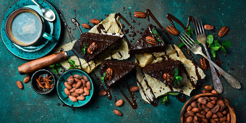 Flat lay composition with fresh brownies and a hot cup of coffee. Sweets Top view.
