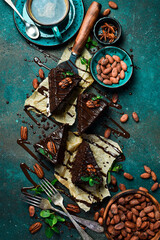 homemade chocolate brownies on a dark background. Sweets and chocolate. Top view.