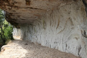 Closeup shot of an old wall with different patters and lines on it in a park
