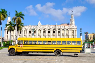 Foto op Canvas Vintage yellow bus parked in the main square in Havana, Cuba © alekampo