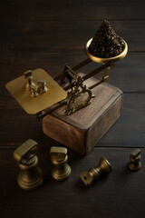 Black caviar. Brass antique scales.Black caviar is on the scales. A delicacy of sturgeon fish. A...
