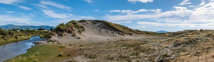 Panoramic view of Waitohu Stream to left, sand dunes, beach at Otaki on Kapiti Coast of New Zealand