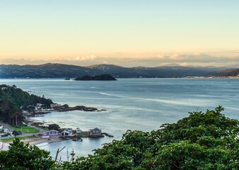 Wellington harbour view with evening shot with the late sun on the Eastern hills
