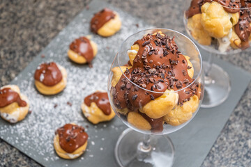 Amazon fruit profiterolis covered in chocolate and cacao nibs