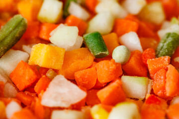 Vegetables mixture of chopped, frozen vegetable string beans, carrots, pumpkin, close-up, selective focus