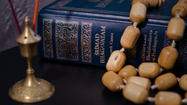 Srimad Bhagavatam and rosary close up.