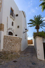 Streets of the old town of Ibiza, with the typical white houses of the island, on a sunny day and without tourists