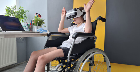 Disabled child girl using virtual reality headset with raised hands at home