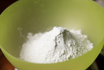 Flour sprinkled with close-up slide. Coarse flour is poured. Preparation for cooking.