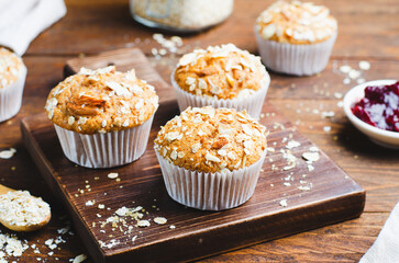 Muffins with Oat and Almond Topping, Rustic Background