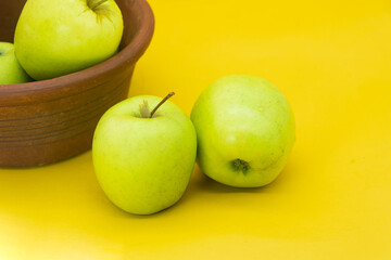 apple isolated on yellow background.