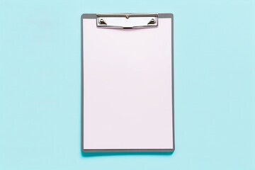 clipboard with clip on light blue background