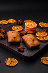 Delicious chocolate muffins and dried round shaped slices of tangerine
