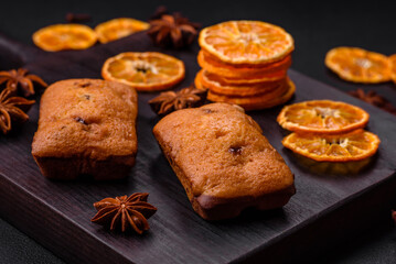 Delicious chocolate muffins and dried round shaped slices of tangerine