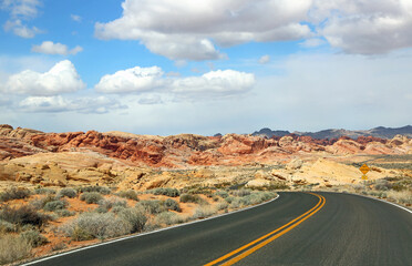 Fototapeta na wymiar The road and Rainbow Vista - Valley of Fire State Park, Nevada