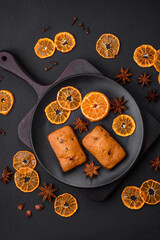 Delicious chocolate muffins and dried round shaped slices of tangerine