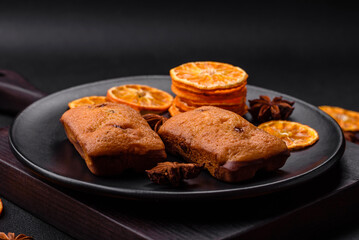 Delicious chocolate muffins and dried round shaped slices of tangerine