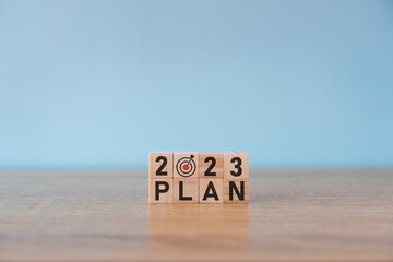 2023 year, target board print screen on wooden block cube for setup new year business objective and goal concept.
