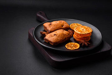Delicious chocolate muffins and dried round shaped slices of tangerine
