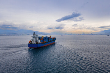 Aerial view container ship driving on the sea for logistic import export or transportation