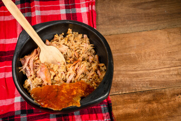 Lechona with rice, arepa and potato