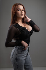 elegant fashion and glamor of latin woman making up and wearing casual clothes, studio portrait of young person