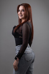 fashion and glamor of beautiful latin woman with makeup and wearing casual clothes, studio portrait of young person, joy