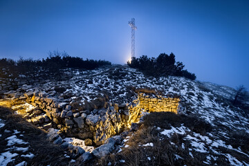 Monte Maggio by night: the trenches of the Great War and the large cross on the summit. Folgaria,...