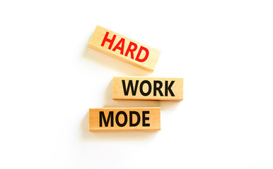 Hard work mode symbol. Concept words Hard work mode on wooden block on a beautiful white table white background. Business and Hard work mode concept. Copy space.