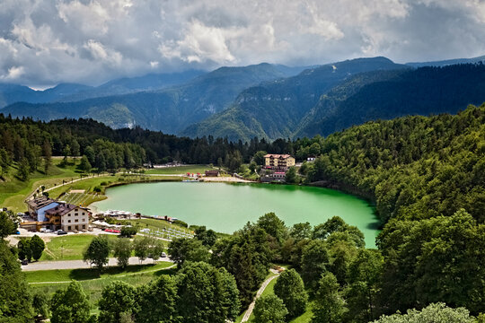 Lake Lavarone and the Venetian Pre-Alps in the background. Alpe Cimbra, Trentino, Italy.