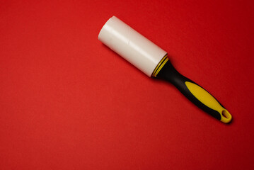 dust removal roll on red background