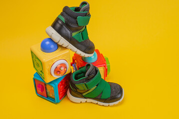 Baby shoes with toys. Concept buy baby shoes.