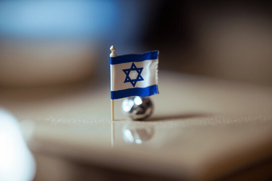 Miniature Israel national flag abstract image. Israel independence day concept. Generative AI