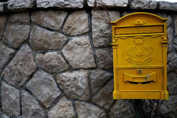 Old yellow mailbox in Montenegro