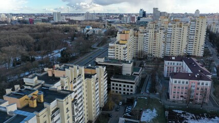 Multi-storey residential building in the center of Minsk and a panorama of the metropolis from a drone from a height. Panoramic view of autumn and spring Minsk, the capital of Belarus